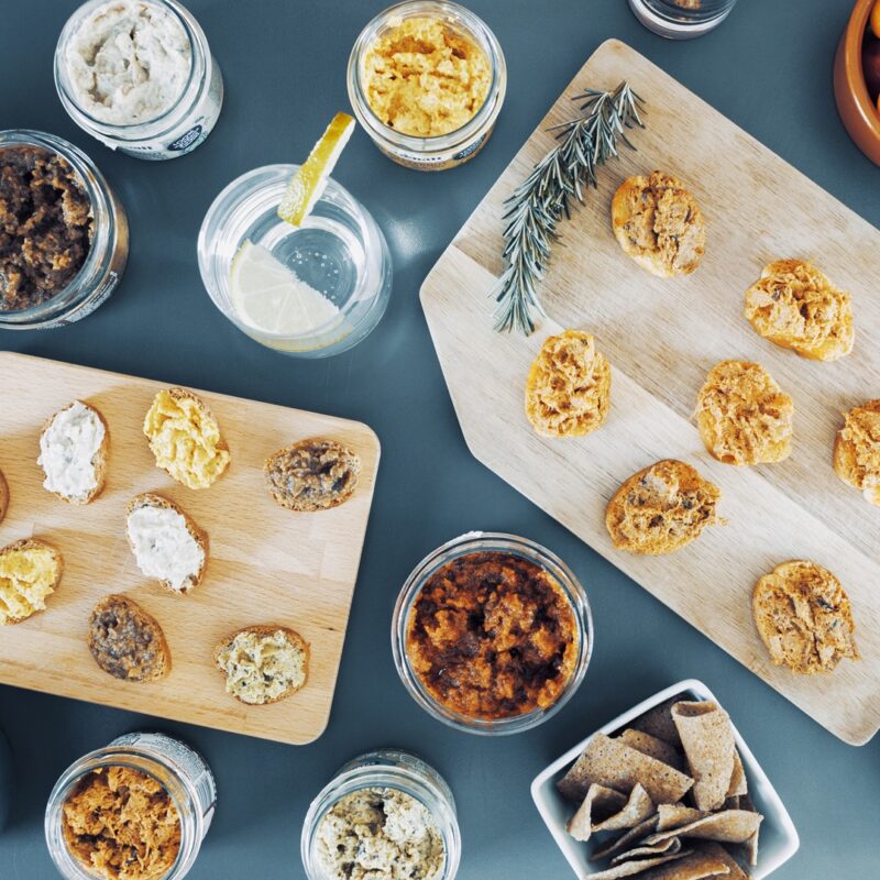 A healthy french appetizer with crackers, dips and spreads